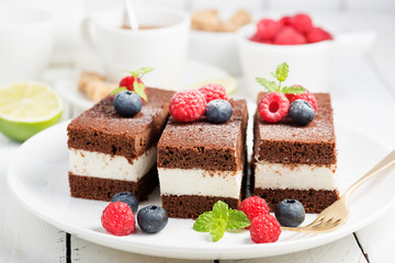 Chocolate creamy cake with  fresh berries.