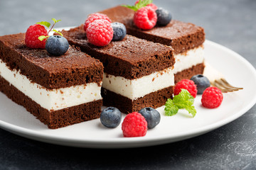 Chocolate creamy cake with  fresh berries.