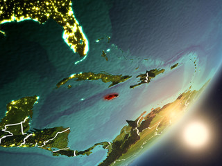 Sun rising above Jamaica from space