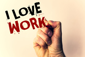 Handwriting text writing I Love Work. Concept meaning To be happy satisfied with job Be doing what you most likeMan holding pen pointing idea message black red letters beige background.