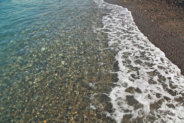 Sea foam on the shore of Black Sea. Sochi.