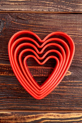 Different sizes heart shaped cake molds. Eco friendly love heart shaped cake molds, top view. Plastic tool for baking.