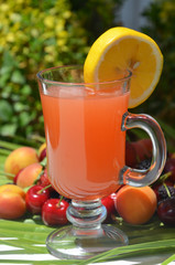 Traditional summer drink sangria - red, pink and white. With champagne, pink and red wine, strawberries, oranges, lemon, green apple and grapefruit. On a wooden rustic table, copy space