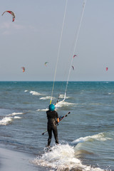 Kitesurfer girl on beach
