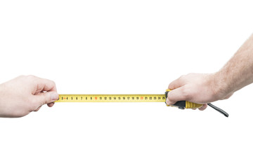 Male hands holding an open yellow tape measure, isolated on a white background, first person view