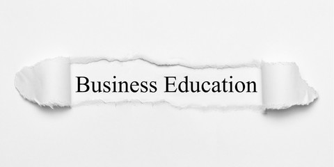 Business Eduucation on white torn paper