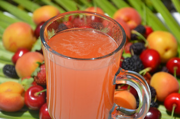 Traditional summer drink sangria - red, pink and white. With champagne, pink and red wine, strawberries, oranges, lemon, green apple and grapefruit. On a wooden rustic table, copy space