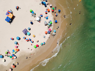 Aerial view of colorful umbrella on the beach