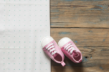 Cute small sized canvas shoes top view on white background with copyspace