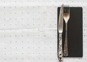 Vintage silverware on a polka dot tablecloth