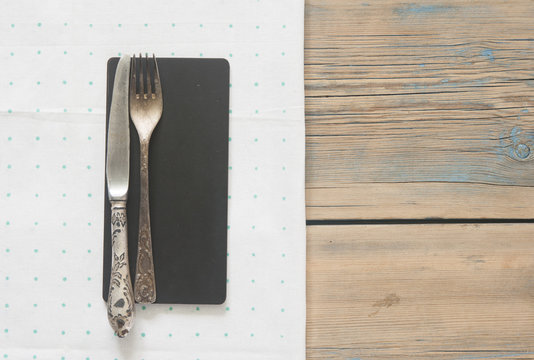 Vintage silverware on a polka dot tablecloth - Powered by Adobe