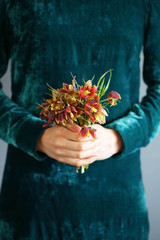 Beautiful wildflowers in the hands of women