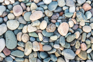 Close up of rounded and polished beach rocks