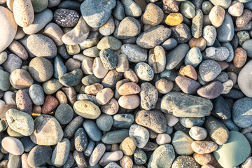 Close up of rounded and polished beach rocks