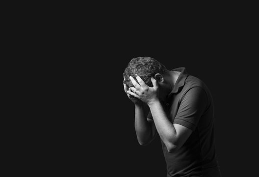 sad man with depression Photos | Adobe Stock