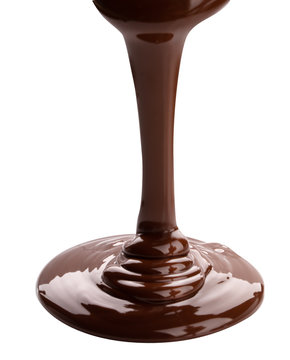 Melted chocolate flowing. Isolated on white background with clipping path