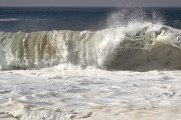 Large powerful wave crashing in the ocean 