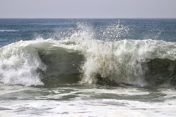 Large powerful wave crashing in the ocean 