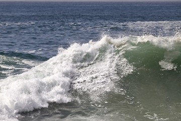 Large powerful wave crashing in the ocean 