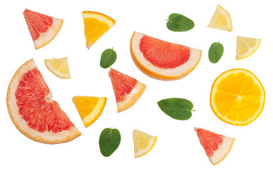 Sliced pieces of citrus fruits isolated on white, top view