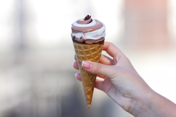 Ice cream cone, chocolate ice cream on blurred background, milk dessert on summer vacation, blank for designer, copy space, milk product