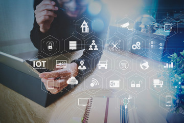 Man using VOIP headset with digital tablet computer docking smart keyboard, concept communication, it support, call center and customer service help desk,filter film effect