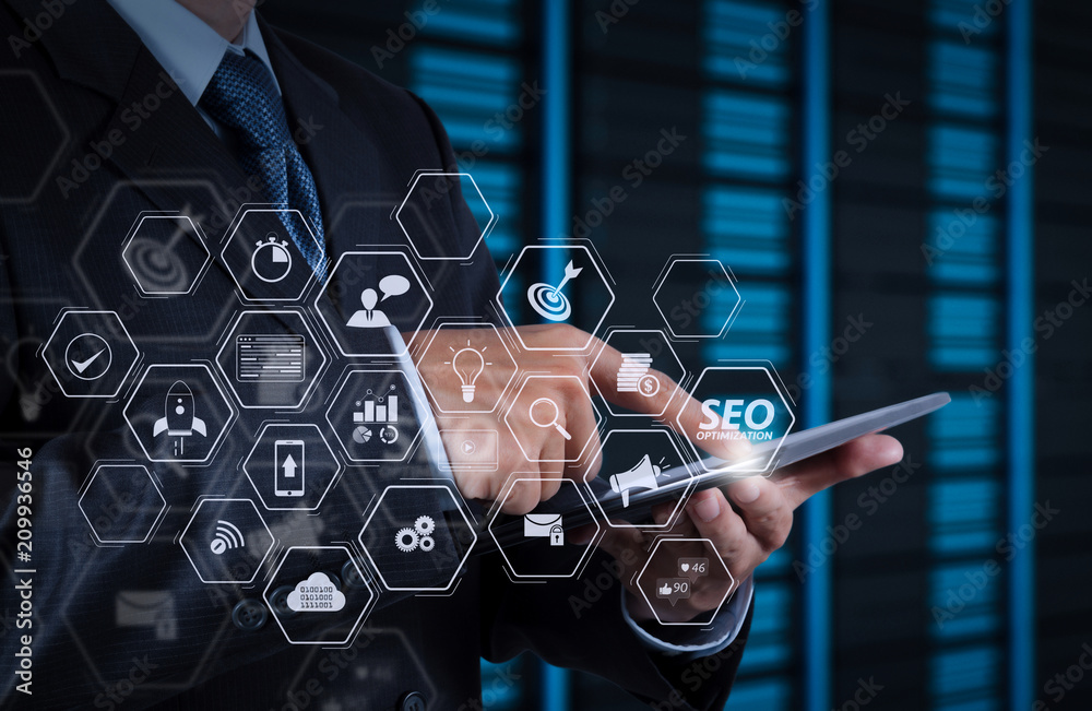 Poster businessman hand using tablet computer and server room