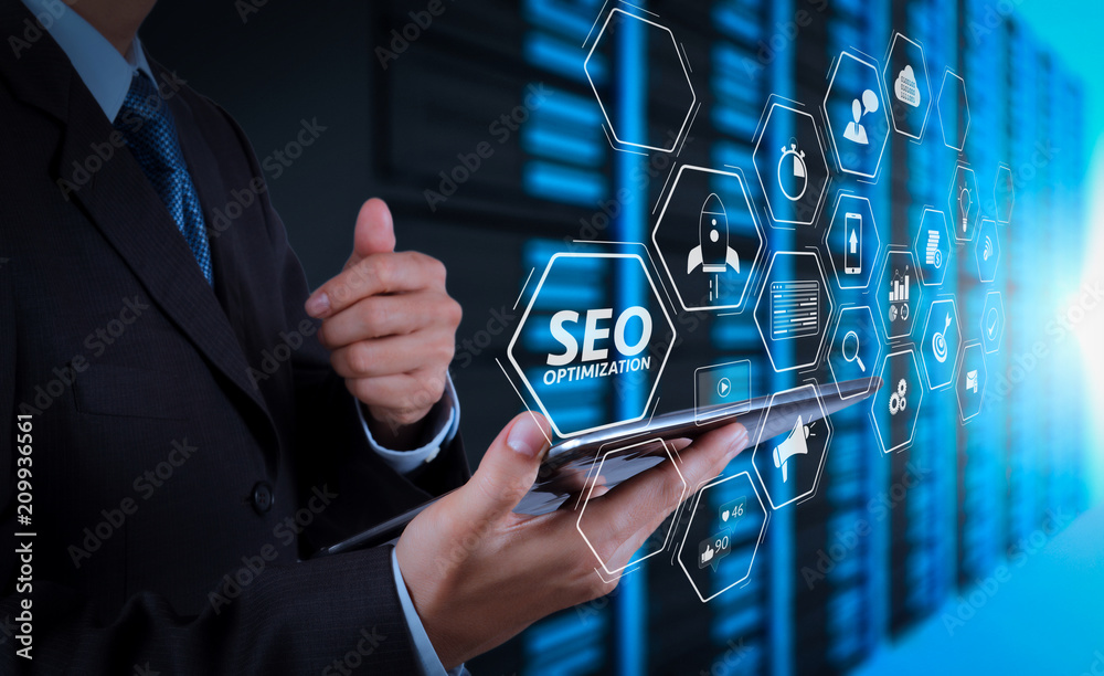 Poster businessman hand using tablet computer and server room