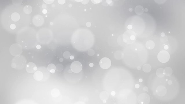 Beautiful silver colored blurry circle bokeh motion background. Christmas and New Year copy space decoration animation. 