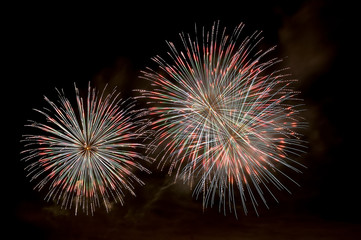 Multi-colored flashes of festive salute fireworks
