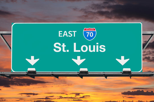 St Louis Missouri route 70 overhead freeway sign with sunset sky.
