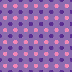Seamless purple, violet and magenta pink bright colourful dot pattern background. Ideal for gift wrapping paper or birthday party designs.