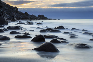 Boulders in sea at rocky beach of Utakleiv, Lofoten