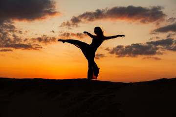 Silhouette of a dancer at sunset.