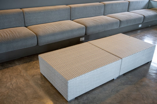 Woven wicker seamless pattern square tables on concrete floor