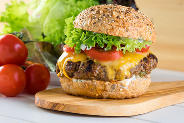 healthy grilled beef burger cheeseburger salad tomato wooden board