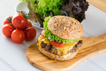 healthy grilled beef burger cheeseburger salad tomato wooden board