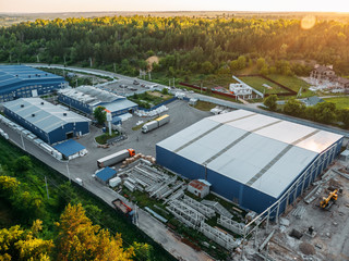 Aerial view of warehouse storages or industrial factory or logistics center from above. Aerial view...