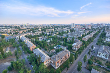 Aerial View of residential district in wonderful summer evening.View over the city rooftops with sunlight and foliage.Moderns buildings at Industrial uptown,residential neighbourhood