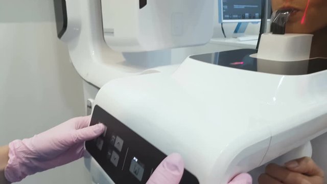 Modern dental x-ray machine taking image of teeth, high-end medical radiography