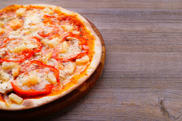 Food background, Hawaiian pizza close up with free space. Traditional Italian recipe, delivery, restaurant, pizzeria menu concept