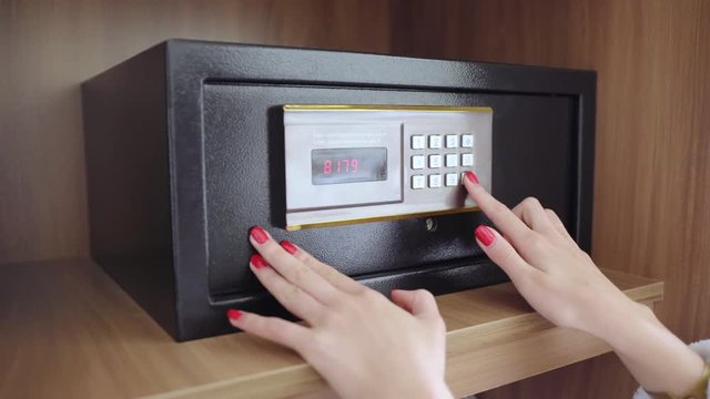 An unrecognized woman with red nails in her dressing gown enters the code and opens the safe in the hotel. Takes a passport and money safely.