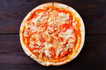 Hawaiian pizza with pineapple and ham, traditional recipe, delicious eating for foodie. Food delivery, restaurant, pizzeria menu concept