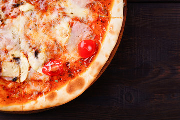 Food background, sliced sicilian pizza with ham and black olives close up with free space. Traditional Italian recipe, delivery, restaurant, pizzeria menu concept