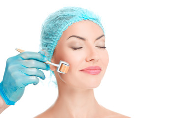 young beautiful woman having an injection mesotherapy