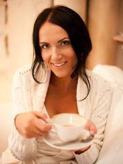  female holding a mug of coffee 
