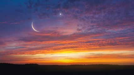  Light from sky . Religion background . The sky at night with stars. New moon . Ramadan background . Prayer time .  Dramatic nature background . Arab night   . eclipse of the moon