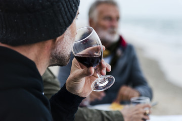 Seniors having a dinner party at the beach