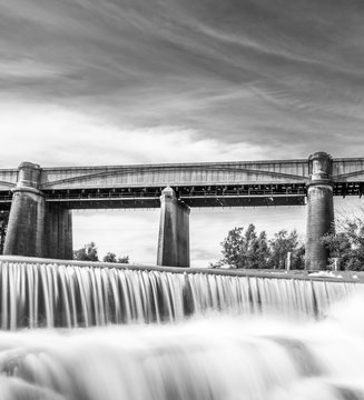 Neutral Density Black and white shout of a waterfall infront of train bridge, NSW, Australia