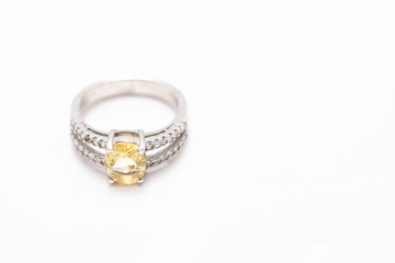 Yellow gem stone on diamond ring